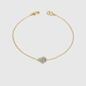 14k gold plated sterling silver 925 round-cut solitaire bracelet with a pure white cubic zirconia, shown on a plain background.