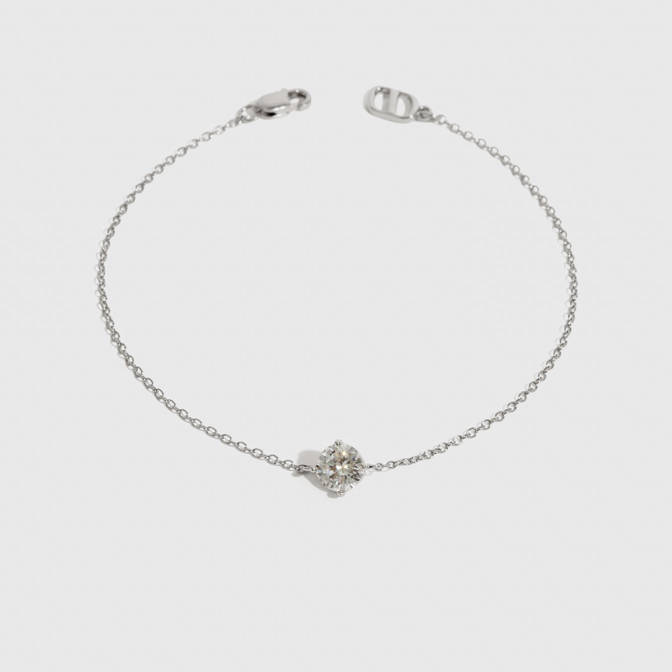 Sterling silver 925 round-cut solitaire bracelet with a pure white cubic zirconia, shown on a plain background.