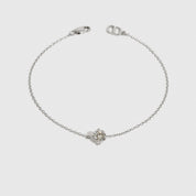 Sterling silver 925 round-cut solitaire bracelet with a pure white cubic zirconia, shown on a plain background.