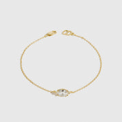 14k gold plated sterling silver 925 marquise-cut solitaire bracelet with a pure white cubic zirconia, shown on a plain background.