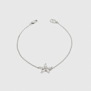 Sterling silver 925 flower solitaire bracelet with a pure white cubic zirconia, shown on a plain background.