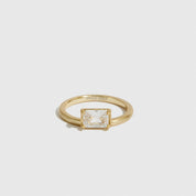 14k gold plated sterling silver 925 baguette-cut solitaire ring with a baguette-cut cubic zirconia, shown on a plain background.