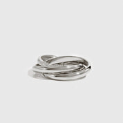 Silver ring on a light gray background