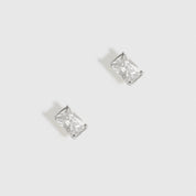 Sterling silver 925 baguette-cut solitaire stud earrings with a pure white cubic zirconia, shown on a plain background.