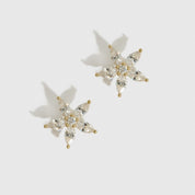 14k gold plated sterling silver 925 flower solitaire stud earrings with a pure white cubic zirconia, shown on a plain background.