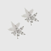 Sterling silver 925 flower solitaire stud earrings with a pure white cubic zirconia, shown on a plain background.