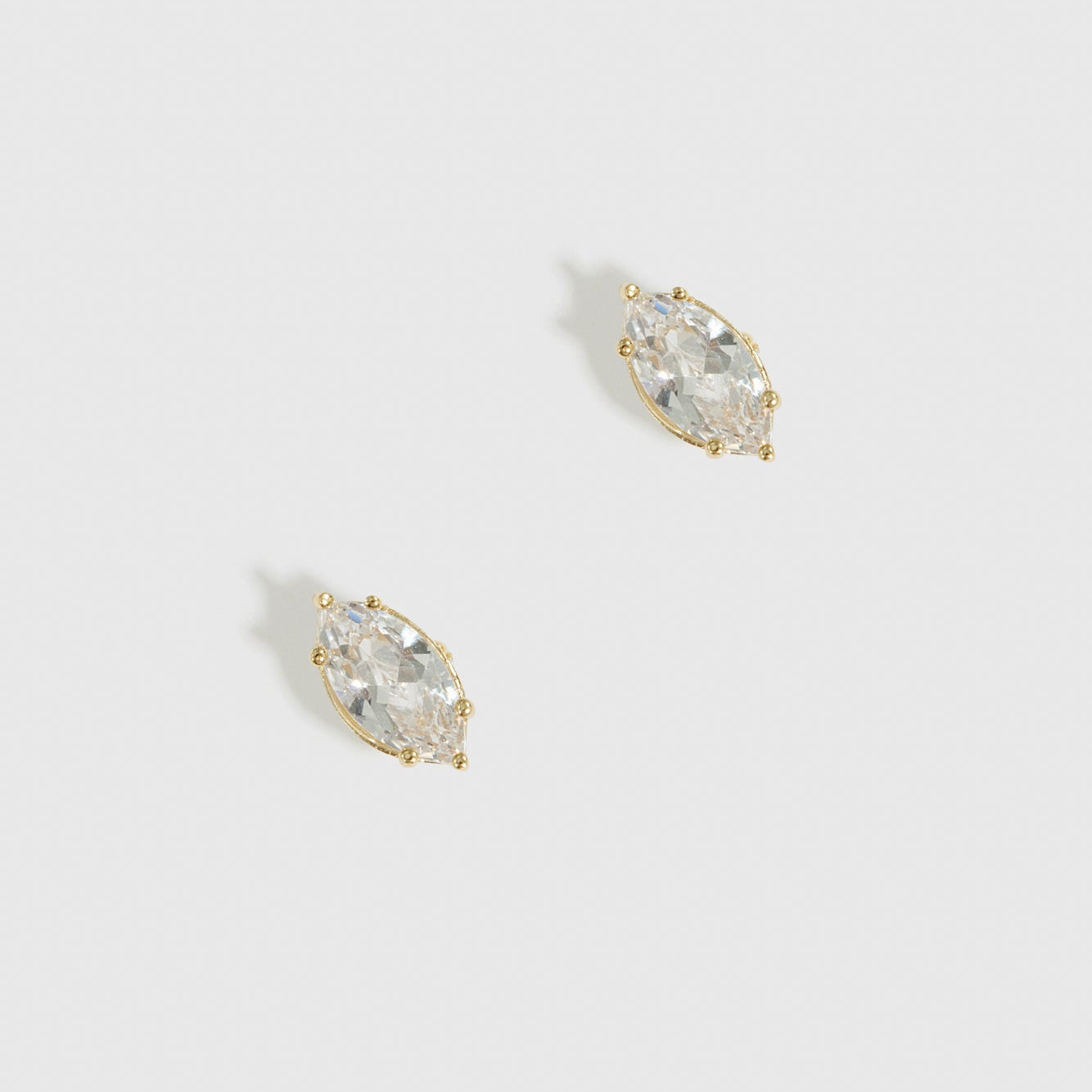 14k gold plated sterling silver 925 marquise-cut solitaire stud earrings with a pure white cubic zirconia, shown on a plain background.