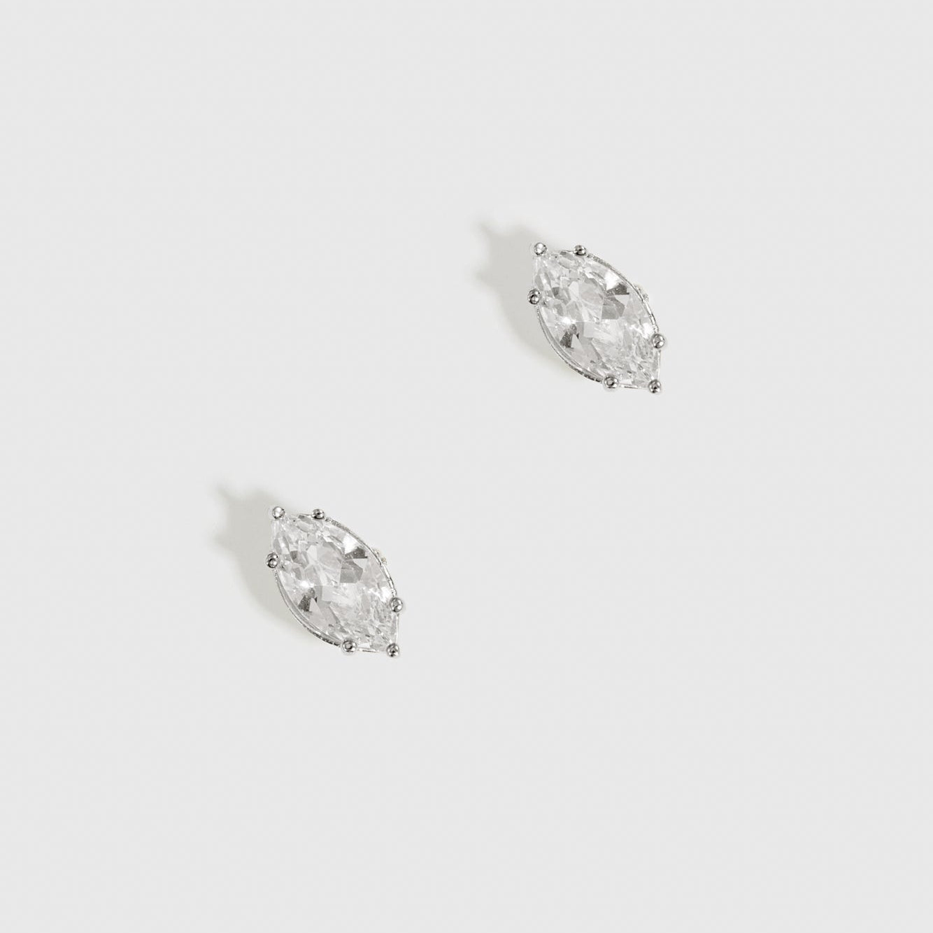 Sterling silver 925 marquise-cut solitaire stud earrings with a pure white cubic zirconia, shown on a plain background.