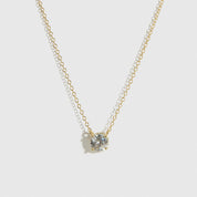 14k gold plated sterling silver 925 round-cut solitaire necklace with a pure white cubic zirconia, shown on a plain background.