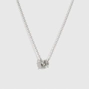 Sterling silver 925 round-cut solitaire necklace with a pure white cubic zirconia, shown on a plain background.