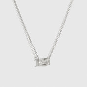 Sterling silver 925 baguette-cut solitaire necklace with a pure white cubic zirconia, shown on a plain background.