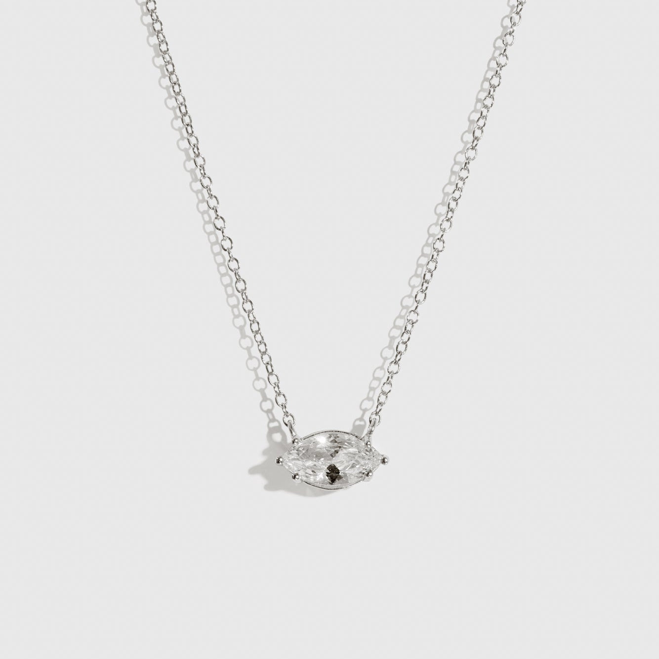 Sterling silver 925 marquise-cut solitaire necklace with a pure white cubic zirconia, shown on a plain background.