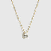 14k gold plated sterling silver 925 regular teardrop-cut solitaire necklace with a pure white cubic zirconia, shown on a plain background.