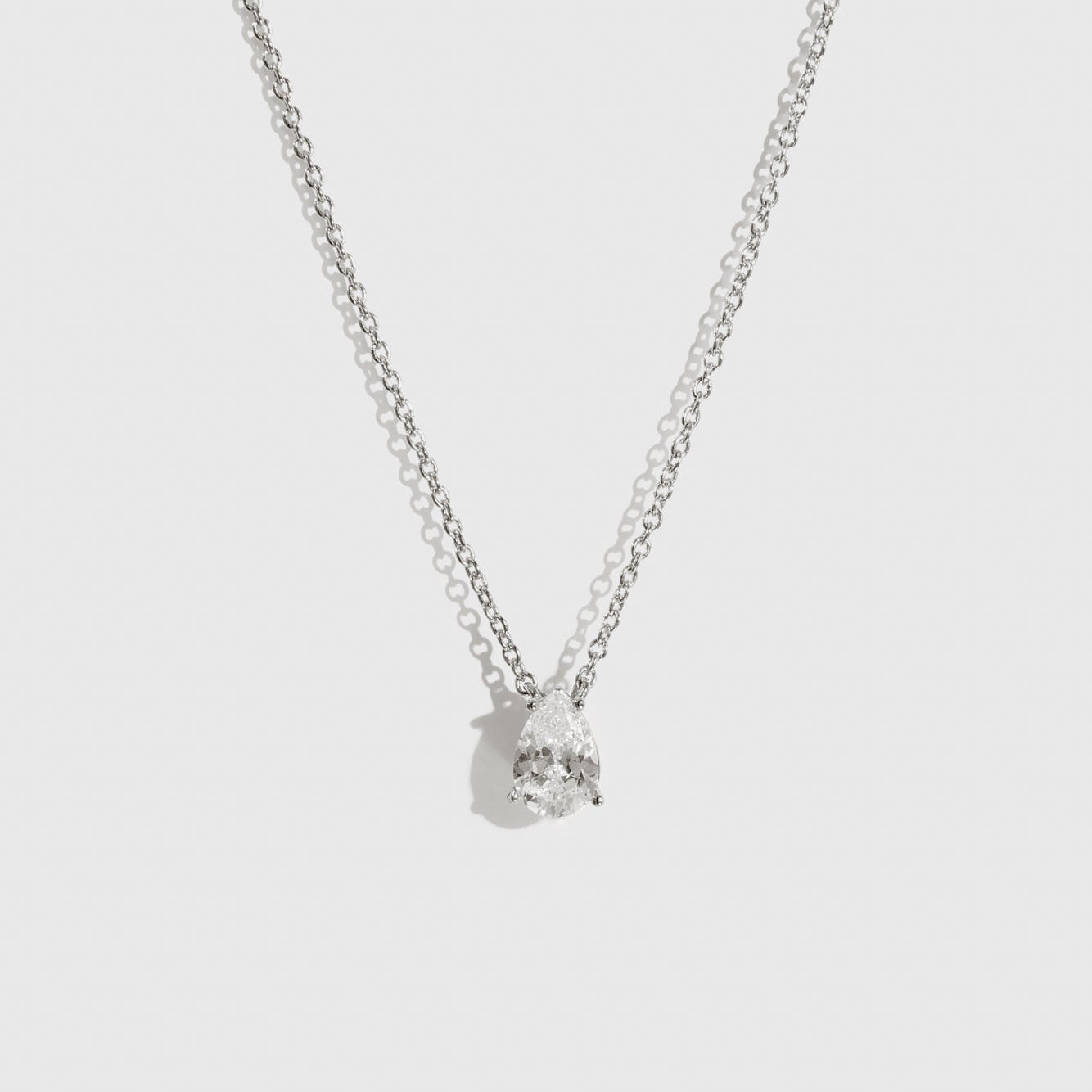 Sterling silver 925 regular teardrop-cut solitaire necklace with a pure white cubic zirconia, shown on a plain background.