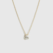 14k gold plated sterling silver 925 mini teardrop-cut solitaire necklace with a pure white cubic zirconia, shown on a plain background.
