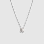 Sterling silver 925 mini teardrop-cut solitaire necklace with a pure white cubic zirconia, shown on a plain background.