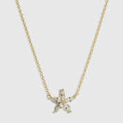 14k gold plated sterling silver 925 flower solitaire necklace with a pure white cubic zirconia, shown on a plain background.