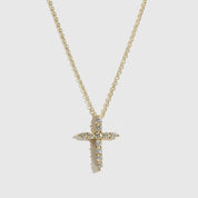14k gold plated sterling silver 925 mini dainty pavé cross necklace with cubic zirconia, shown on a plain background.