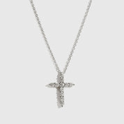 Sterling silver 925 mini dainty pavé cross necklace with cubic zirconia, shown on a plain background.