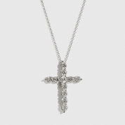 Sterling silver 925 regular dainty pavé cross necklace with cubic zirconia, shown on a plain background.