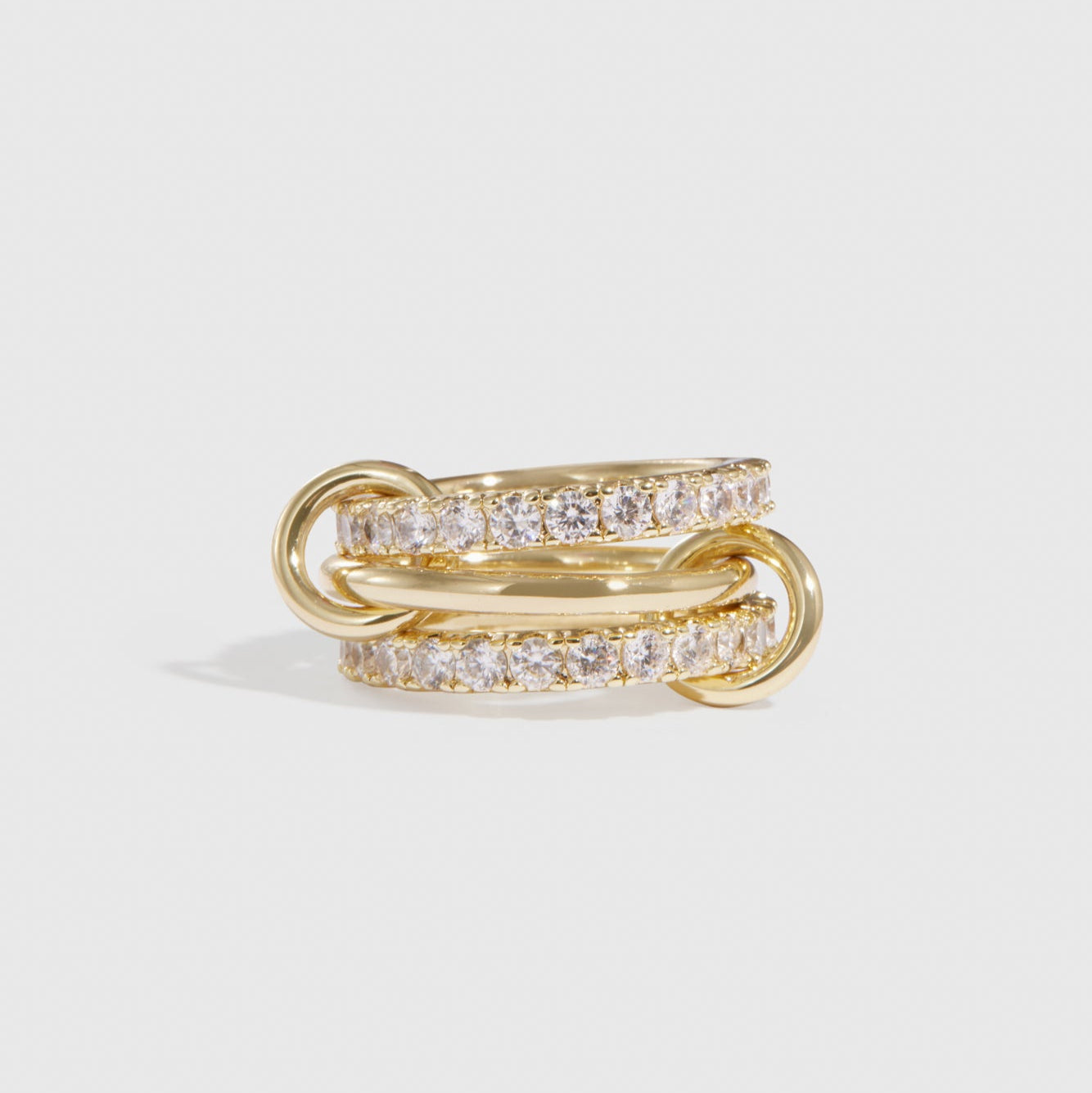 14k gold plated quintuplet interlocking bare links ring with cubic zirconia, shown on a plain background.