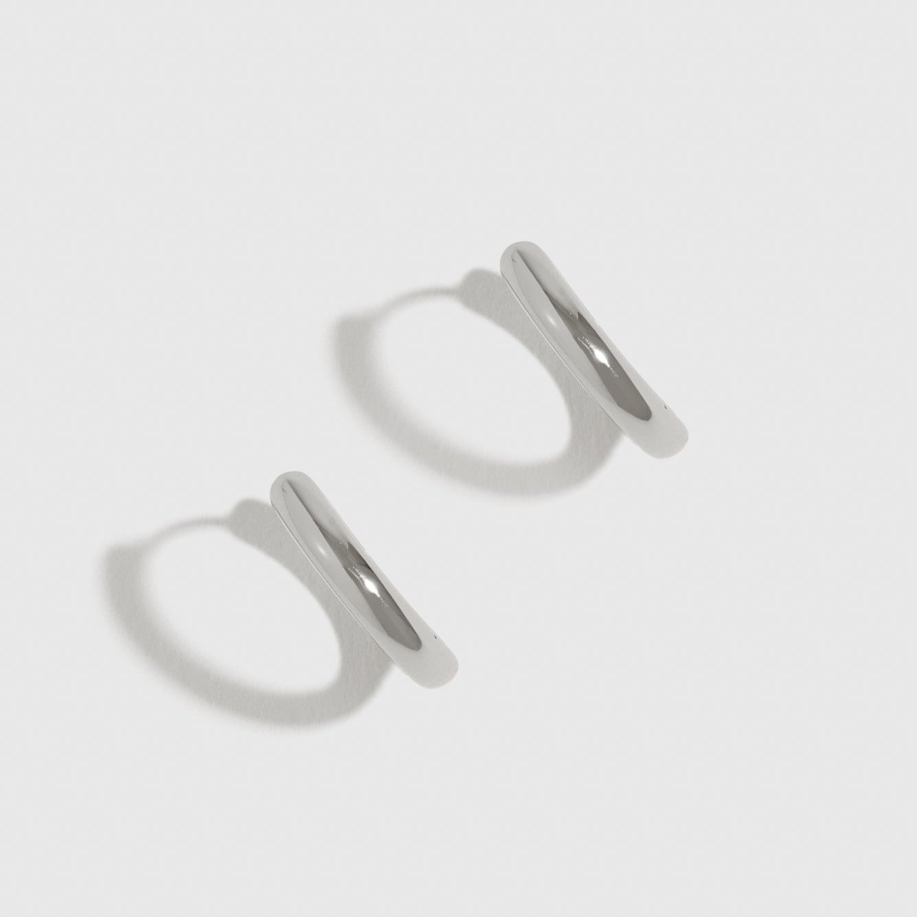 Sterling silver 925 classic plain huggie earrings, shown on a plain background.