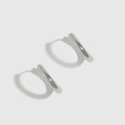 Sterling silver 925 classic plain huggie earrings, shown on a plain background.