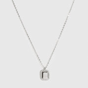 Sterling silver 925 dainty dog tag pendant necklace with cubic zirconia, shown on a plain background.