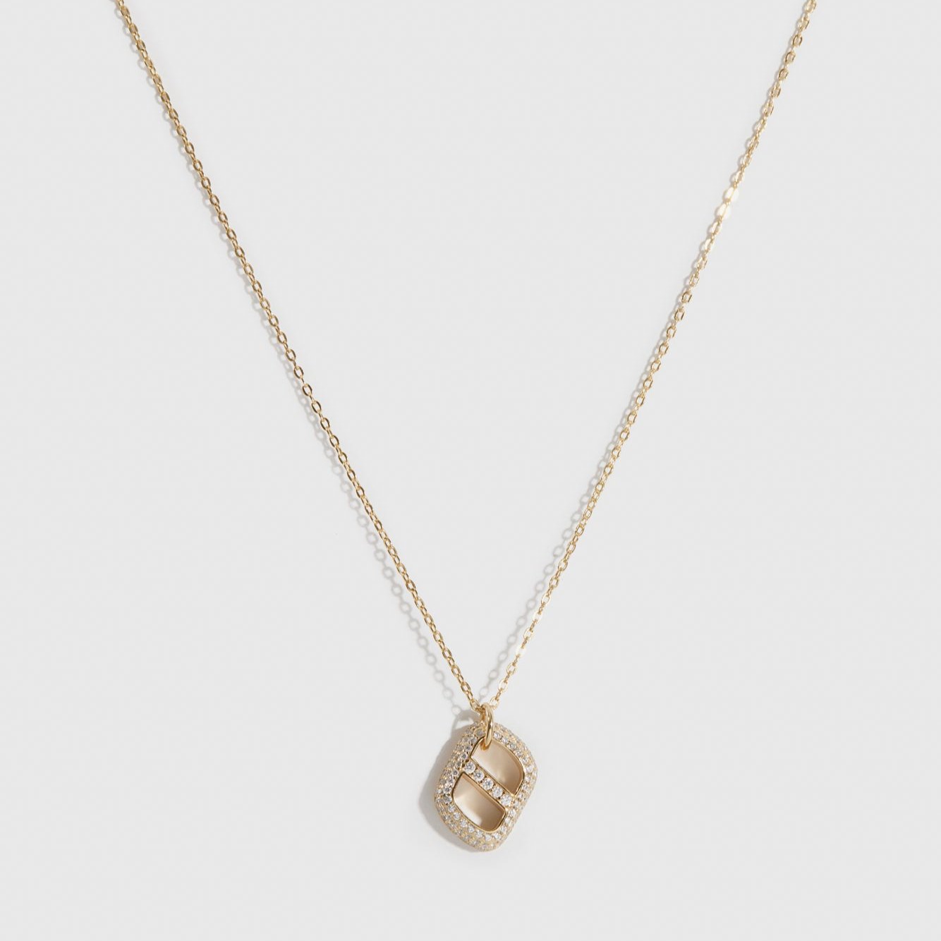14k gold plated sterling silver 925 pavé monogram pendant necklace with cubic zirconia, shown on a plain background.
