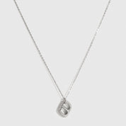 Sterling silver 925 pavé monogram pendant necklace with cubic zirconia, shown on a plain background.