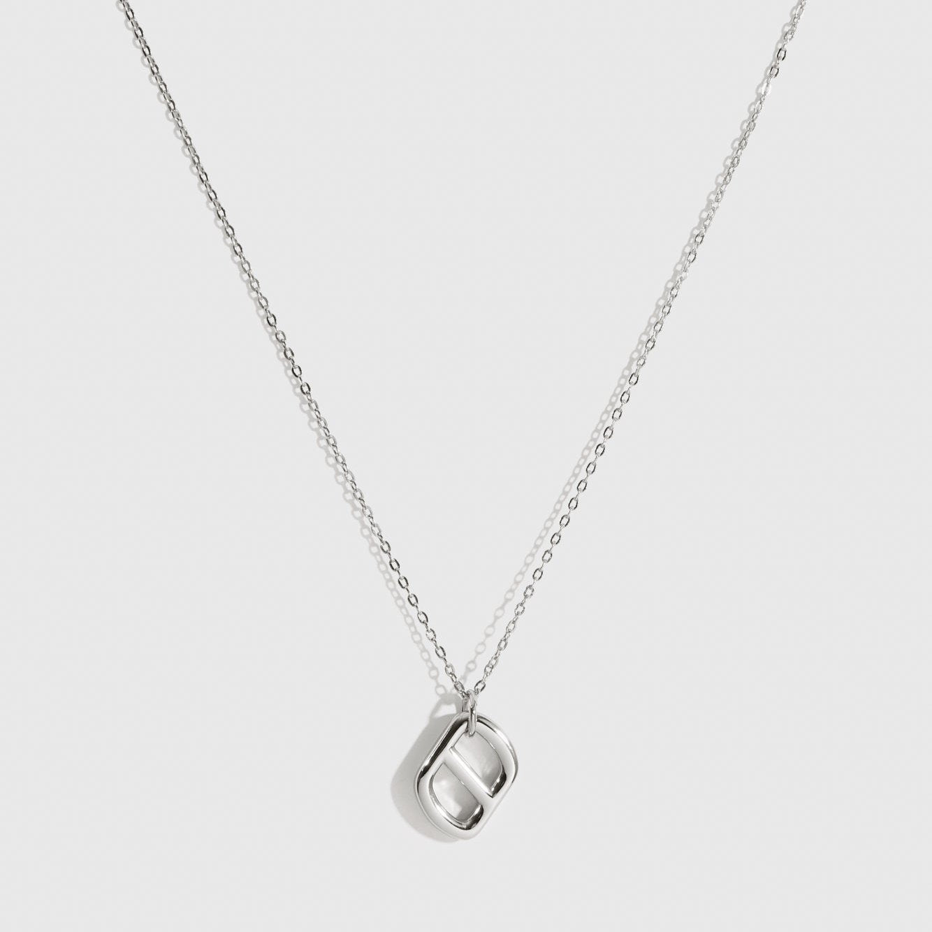 Sterling silver 925 plain monogram pendant necklace, shown on a plain background.