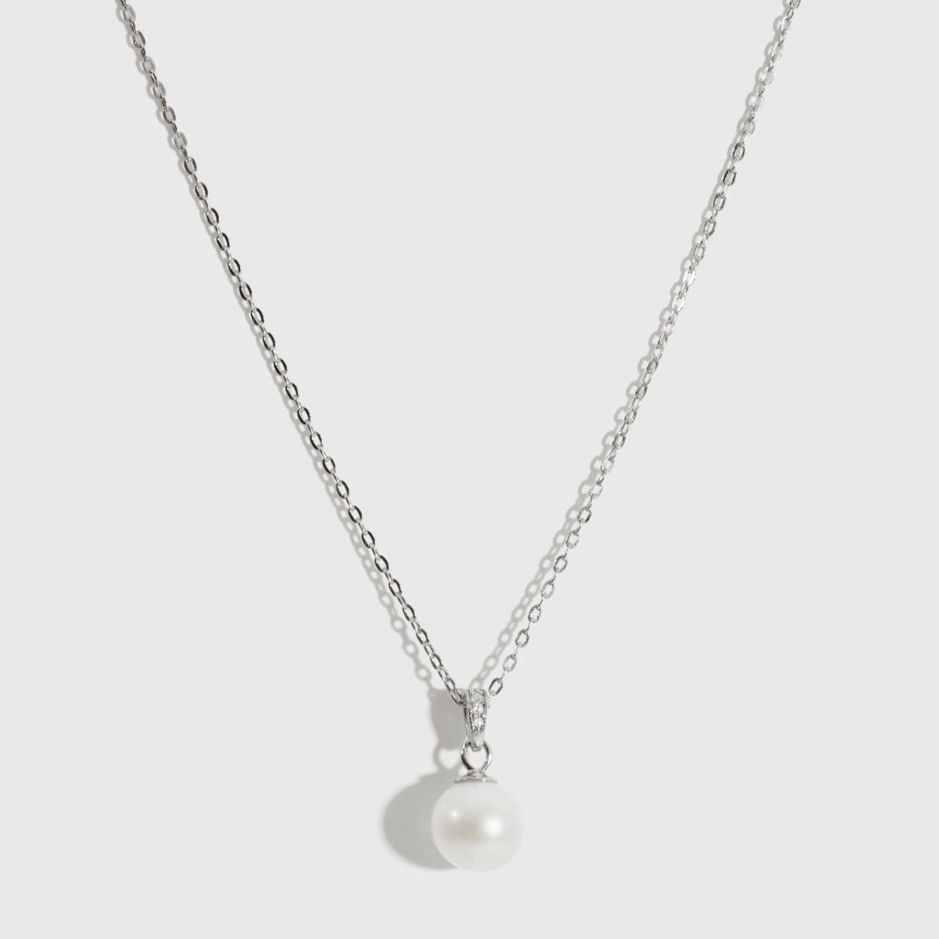 Sterling silver 925 solitaire pearl pendant necklace with a cultured freshwater pearl, shown on a plain background.