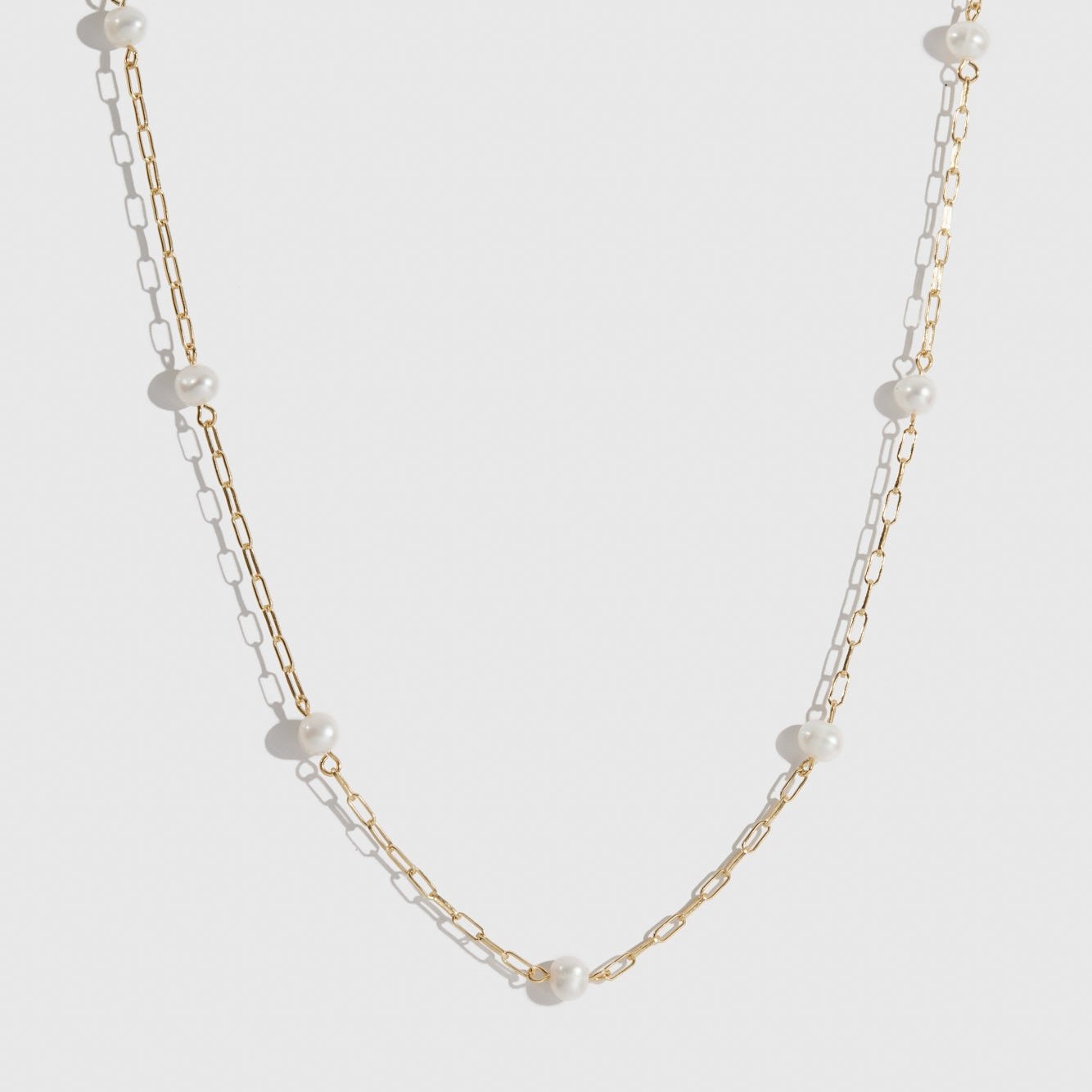 14k gold plated sterling silver 925 multi paperclips and pearls necklace with freshwater pearls, shown on a plain background.