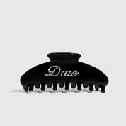 Black acetate hair claw, style 2, shown on a plain background.