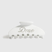White acetate hair claw, shown on a plain background.