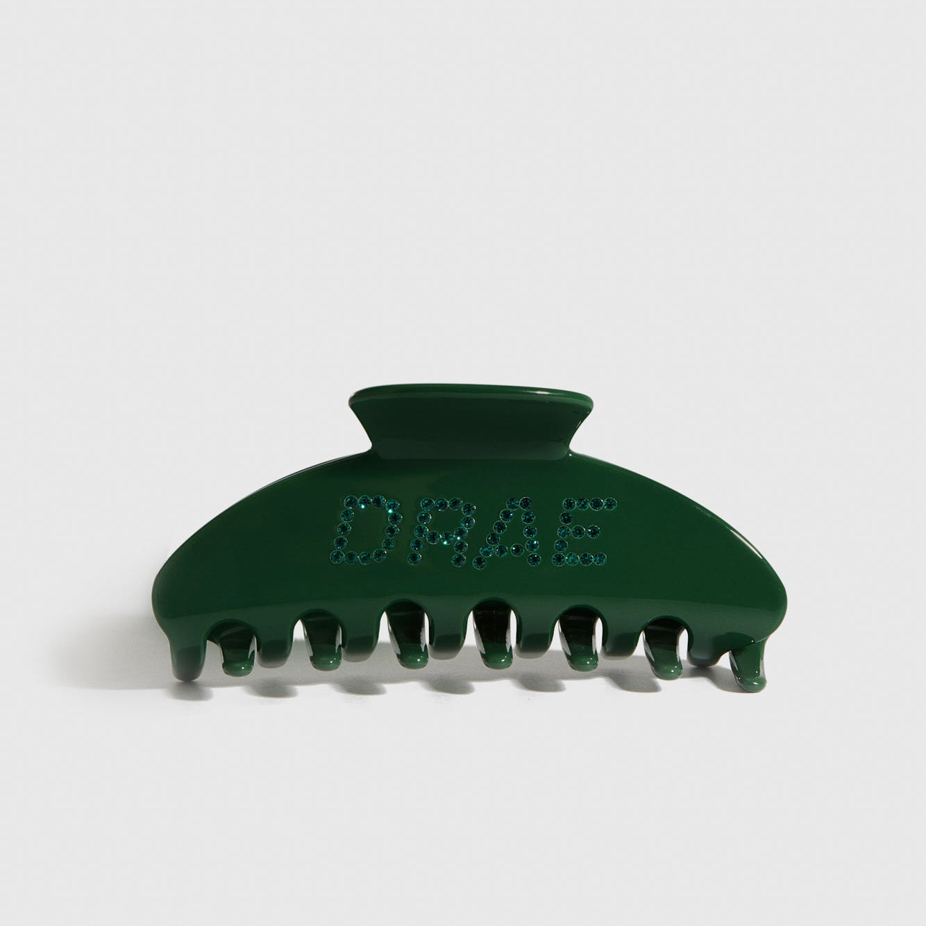 Forest green acetate hair claw, shown on a plain background.