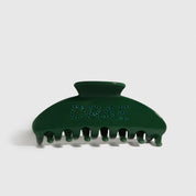 Forest green acetate hair claw, shown on a plain background.