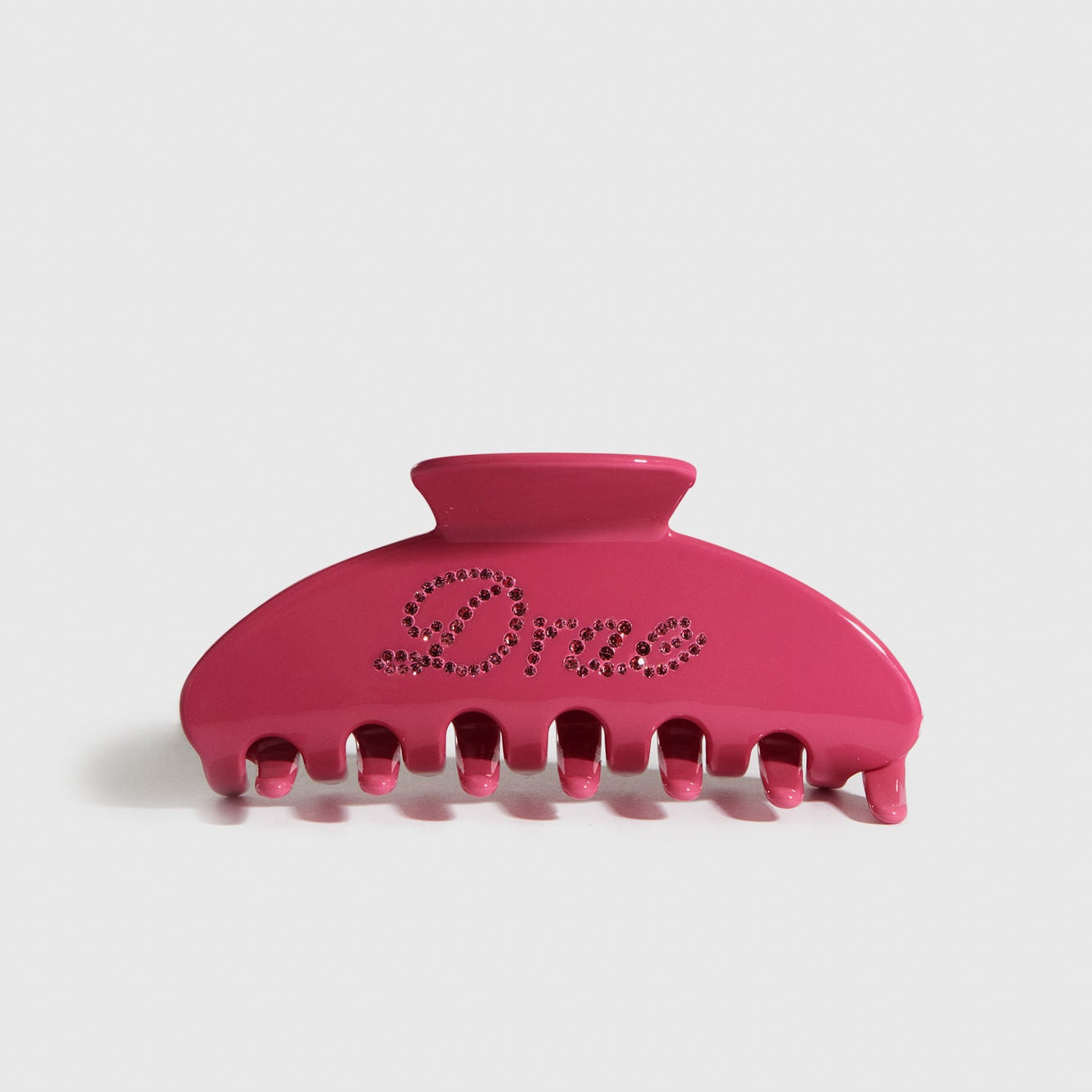 Hot pink acetate hair claw, shown on a plain background.