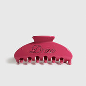 Hot pink acetate hair claw, shown on a plain background.