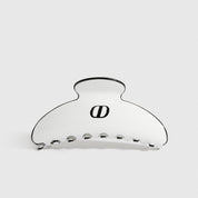 White acetate hair claw, shown on a plain background.