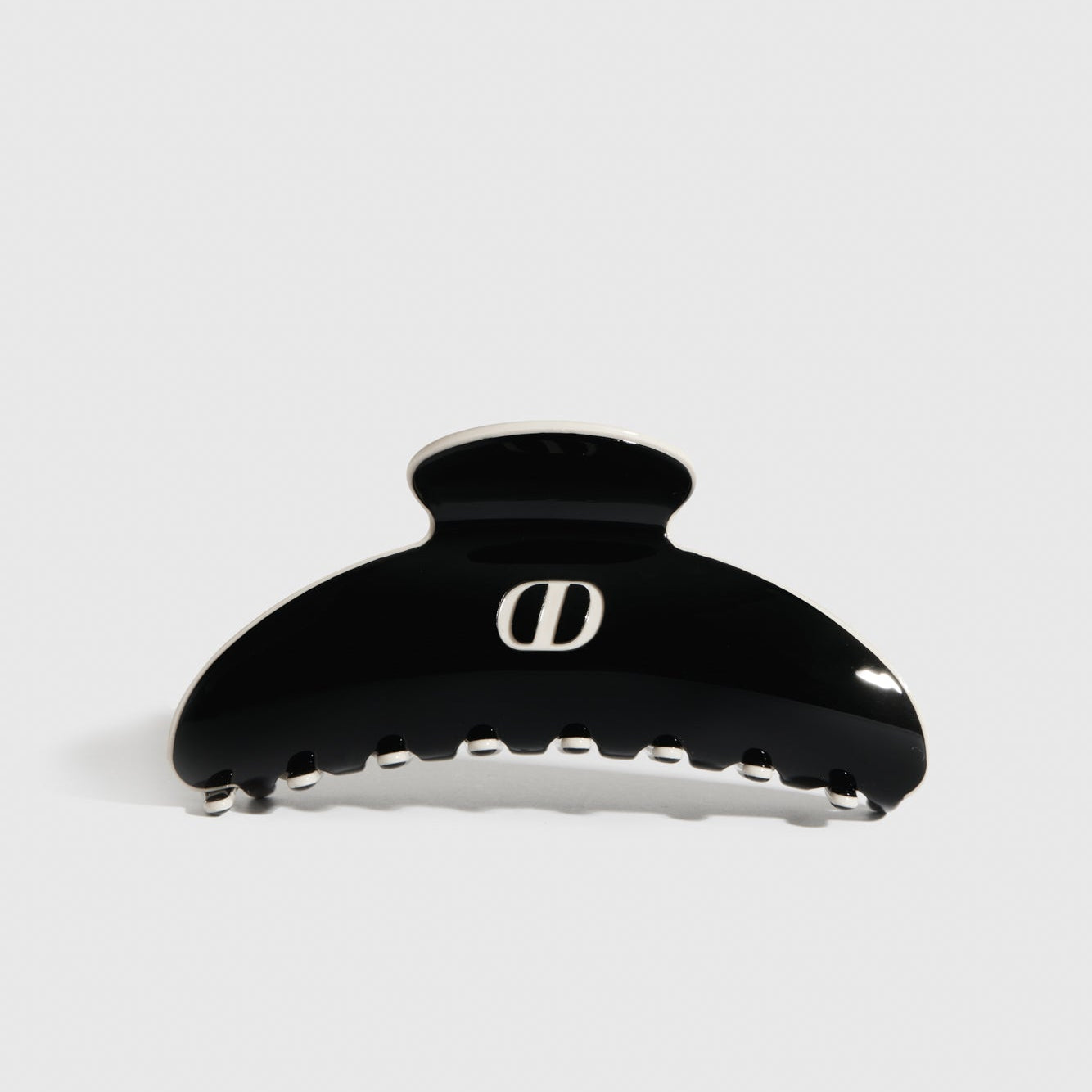 Black acetate hair claw, shown on a plain background.