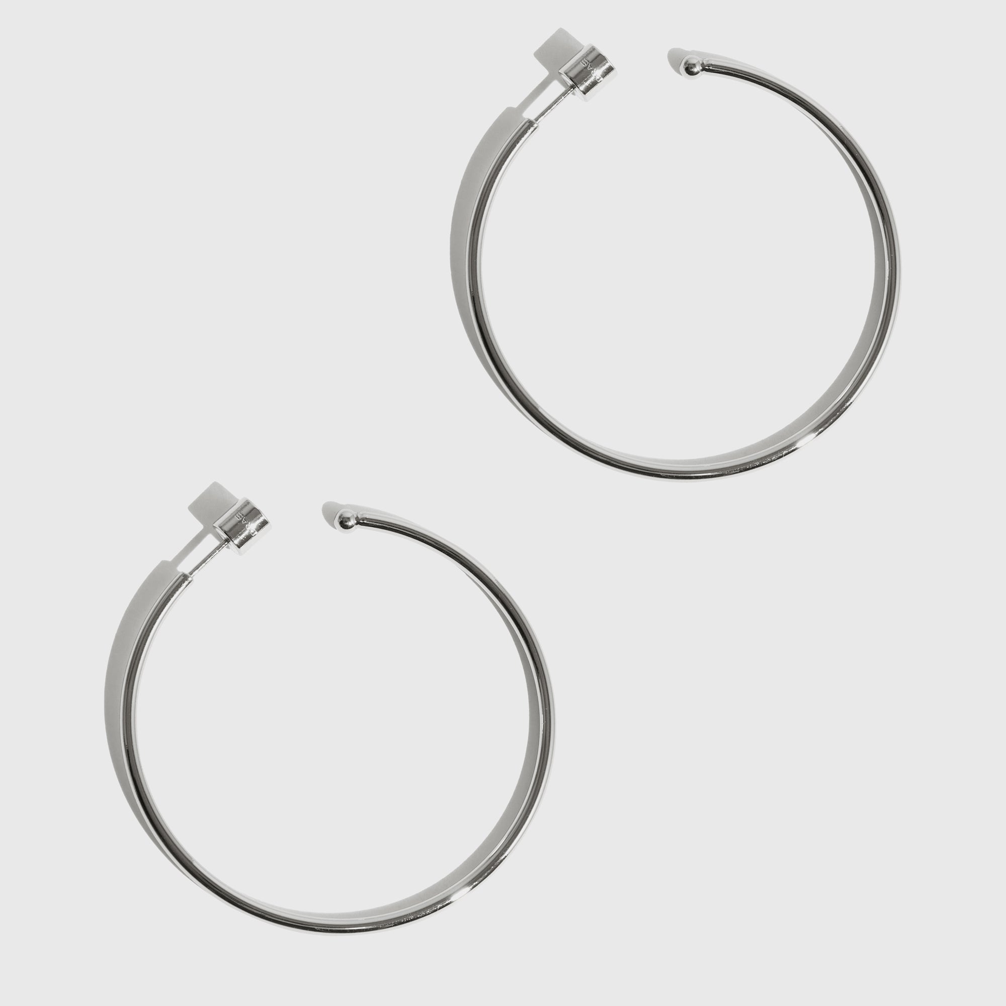 Silver plated large Hazel hoop earrings, shown on a plain background.