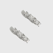 Sterling silver 925 Ophélie hoop earrings with four cuts of cubic zirconia, shown on a plain background.
