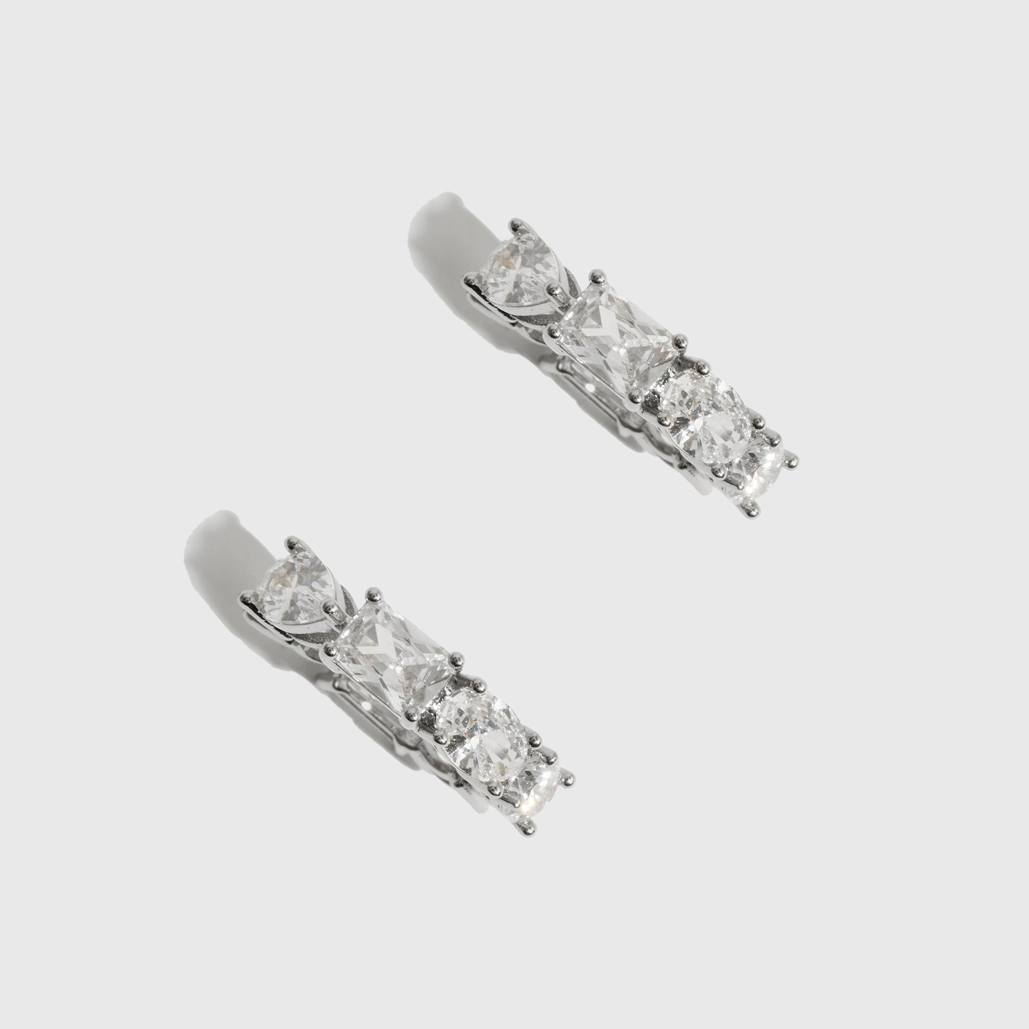 Sterling silver 925 Ophélie hoop earrings with four cuts of cubic zirconia, shown on a plain background.