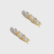 14k gold plated sterling silver 925 Ophélie hoop earrings with four cuts of cubic zirconia, shown on a plain background.