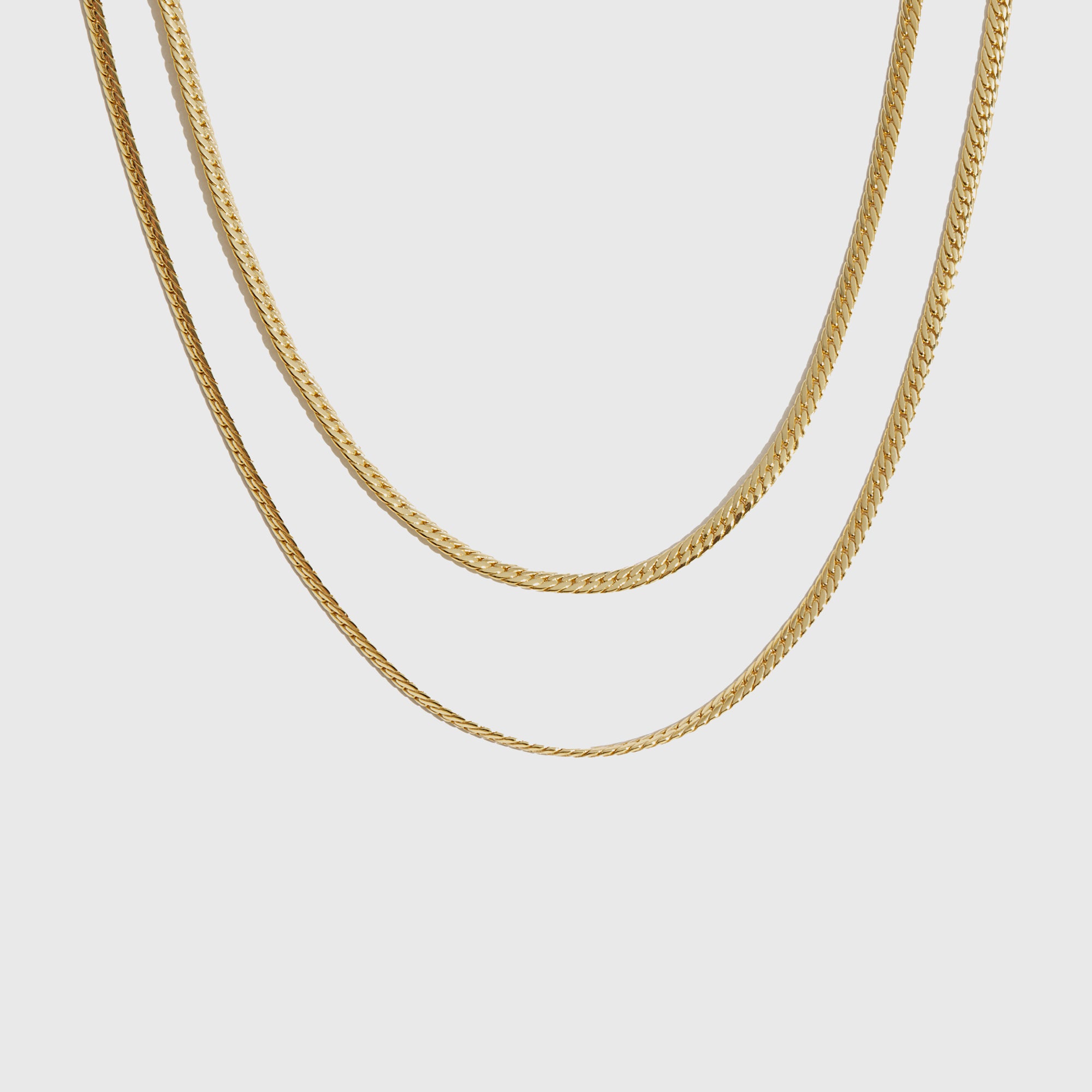14k gold plated layered necklace, shown on a plain background.