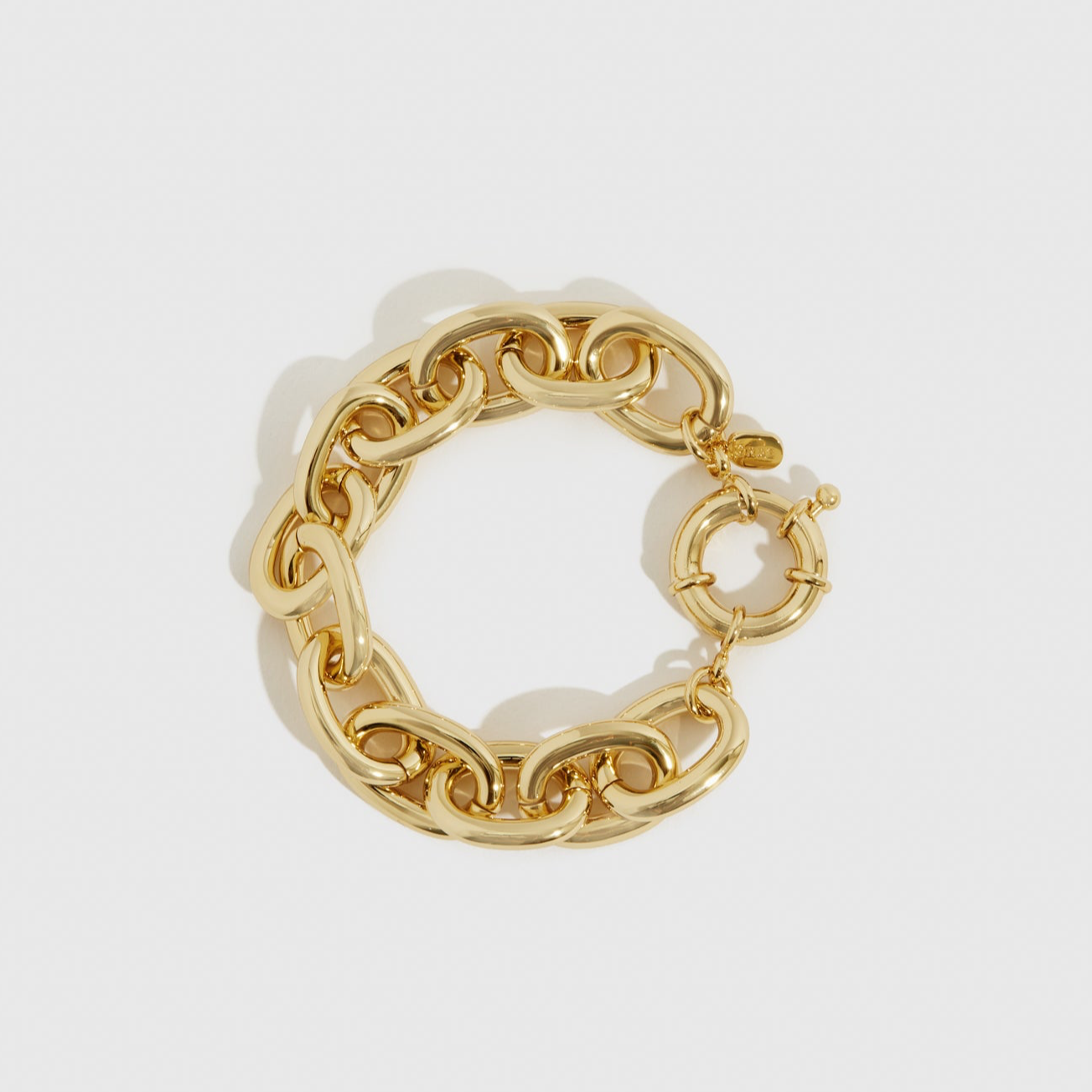 14k gold plated stellar bracelet, shown on a plain background.