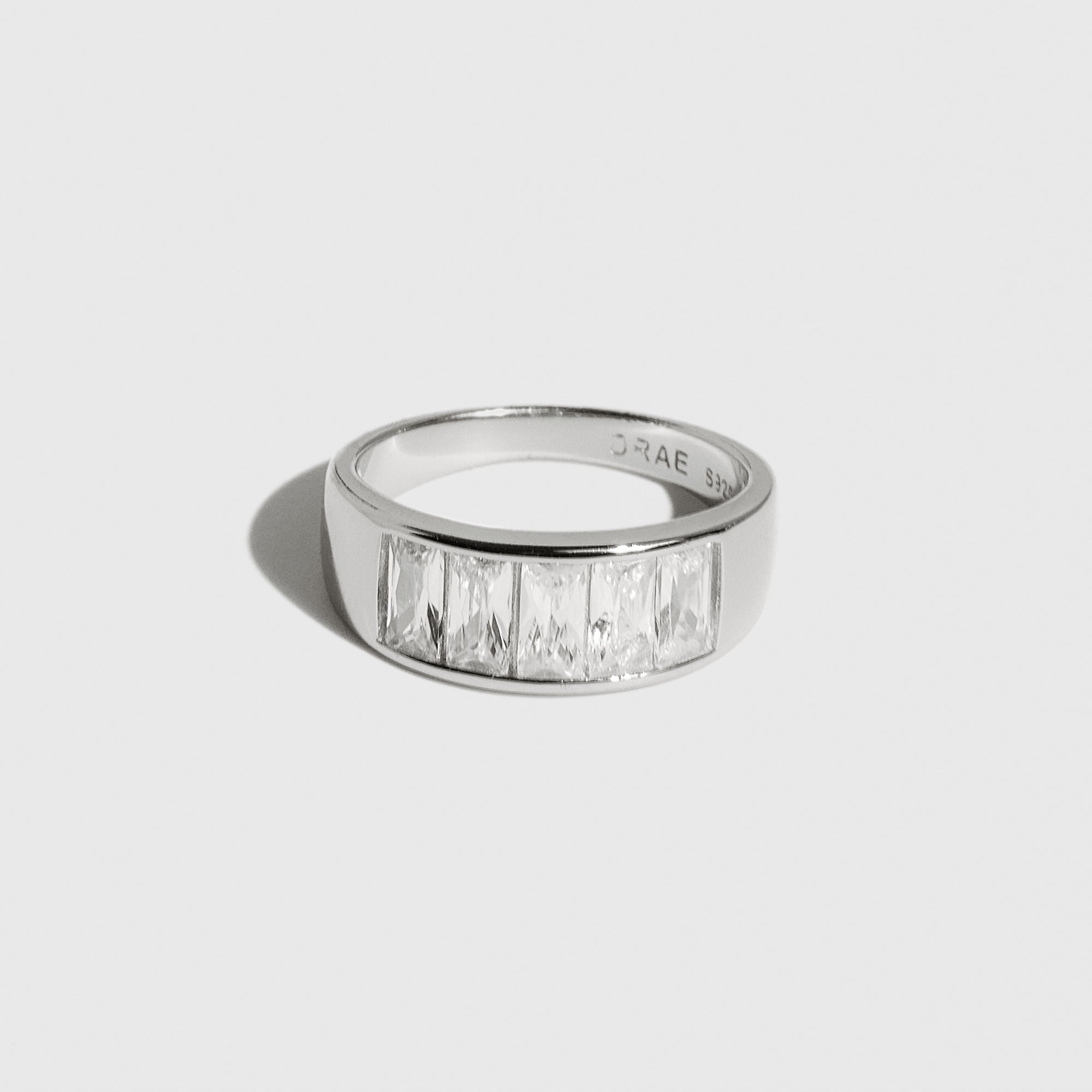 Sterling silver 925 Luna ring with baguette cubic zirconia, shown on a plain background.
